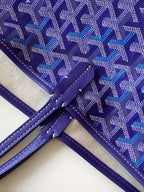 Purple monogram tote bag with cross-stitched handle attachment and piping