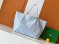 Light blue and white patterned tote bag with dual top handles and open top