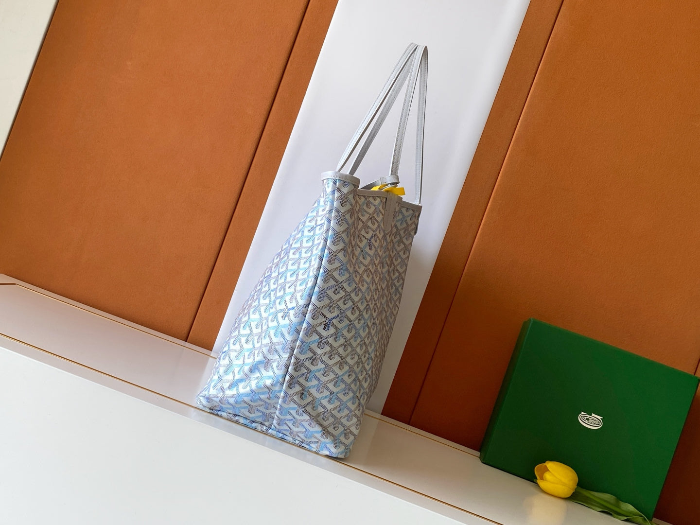Light blue and white patterned tote bag with tall top handles and open top