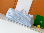 Light blue and white patterned tote bag with curved top handles and structured body