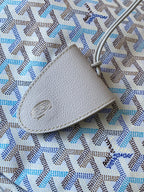 Light blue patterned fabric with light leather trim and oval logo patch