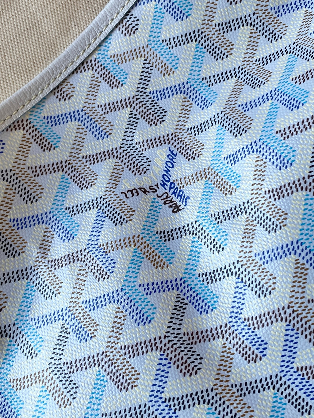 Light blue and white patterned fabric panel with repeating motif