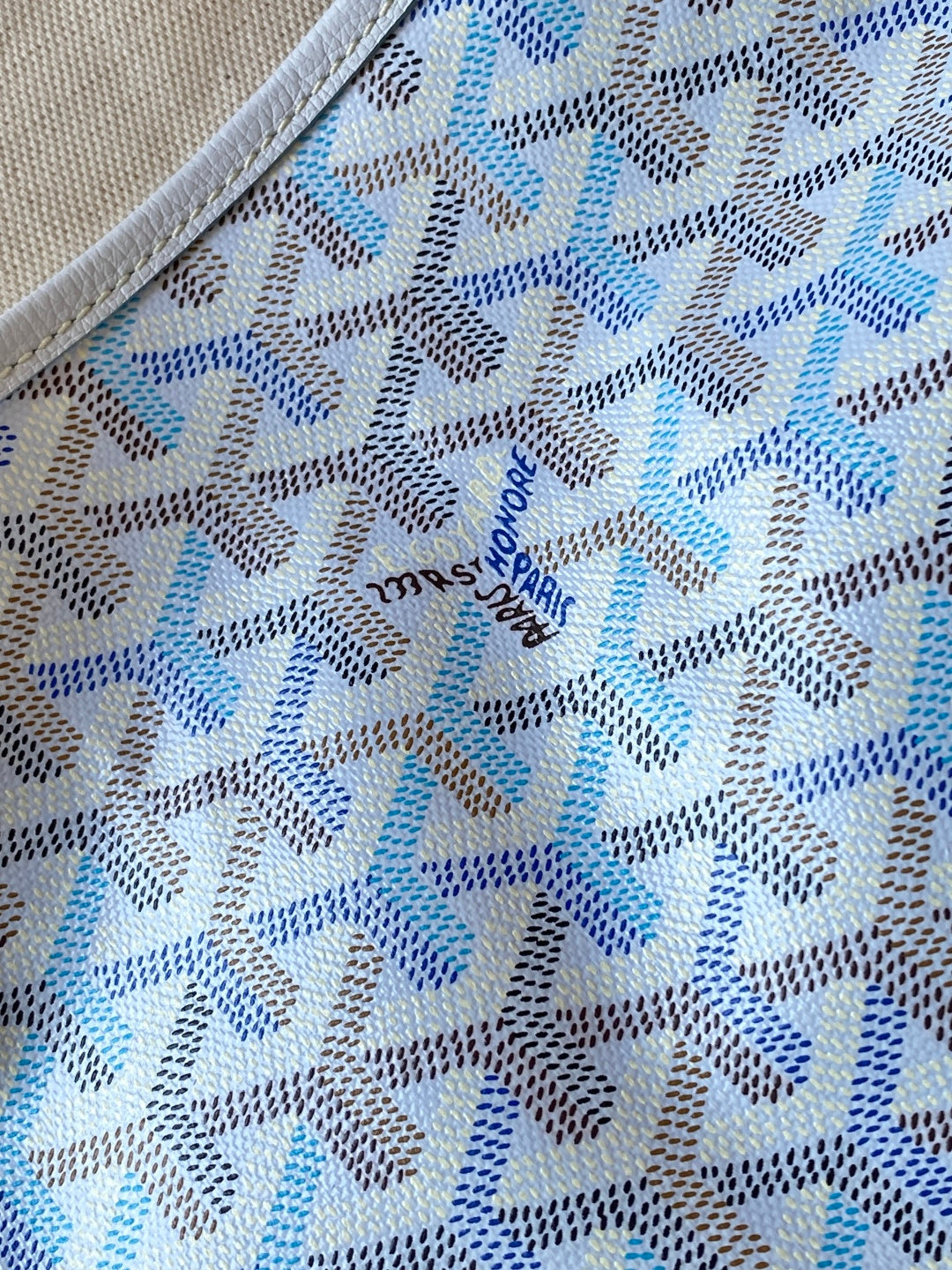 Light blue and white patterned fabric panel with repeating motif