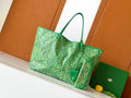 Goyard green patterned tote bag with top handles and front leather pocket
