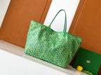 Goyard green patterned tote bag with wide base and top leather handles