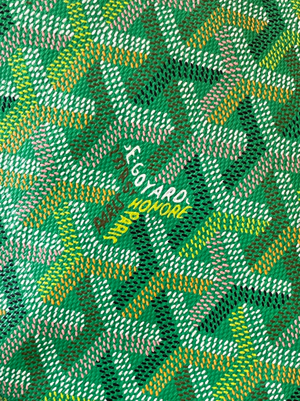Goyard patterned canvas tote fabric with repeating logo text in green and gold