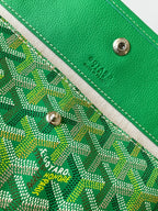 Goyard green leather strap end with metal snap and logo on patterned canvas