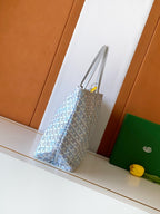 Light blue logo-pattern tote bag with double handles and side profile