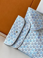 Light blue patterned pouch and matching case set with zipper closures