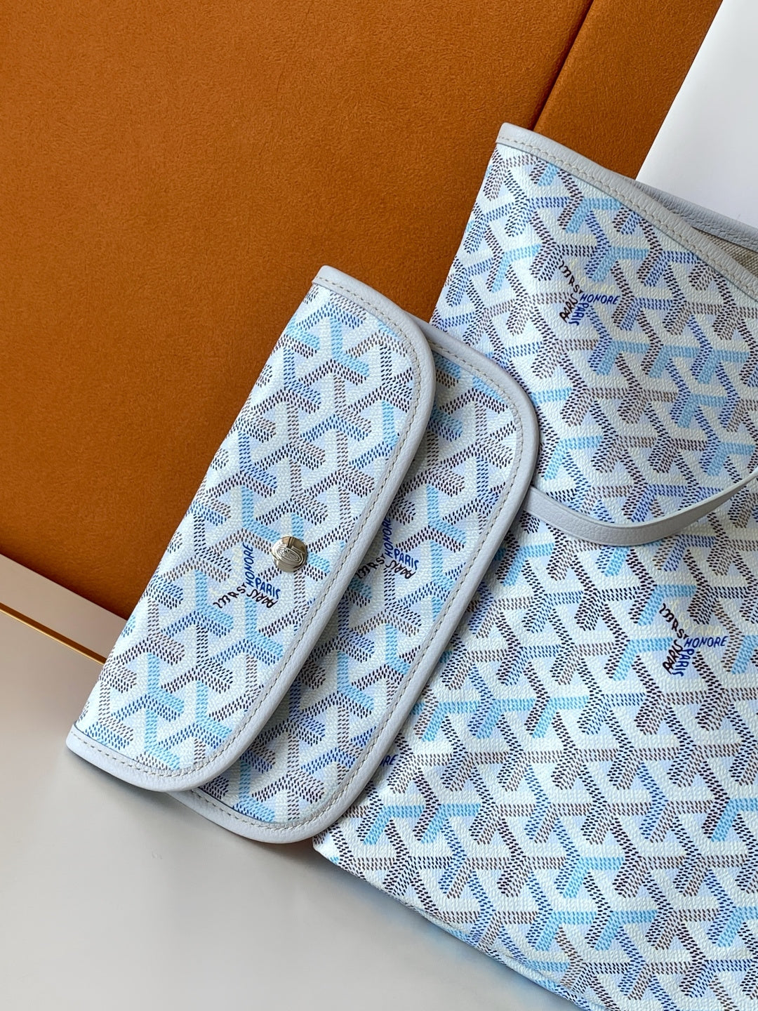 Light blue patterned pouch and matching case set with zipper closures