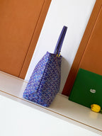Blue patterned tote bag side view with top strap handles and structured base