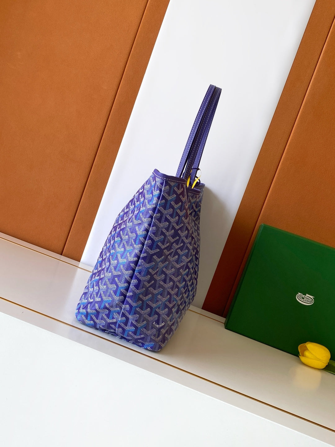 Blue patterned tote bag side view with top strap handles and structured base
