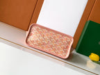 Pink patterned clutch-style pouch with rounded zipper top edge.
