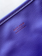 Goyard tote bag leather panel detail with embossed logo in blue