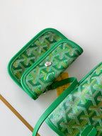 Green patterned pouch wallet with zipper pull and snap closure