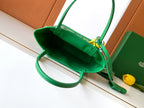 Green tote bag interior view with strap and lined inside pocket