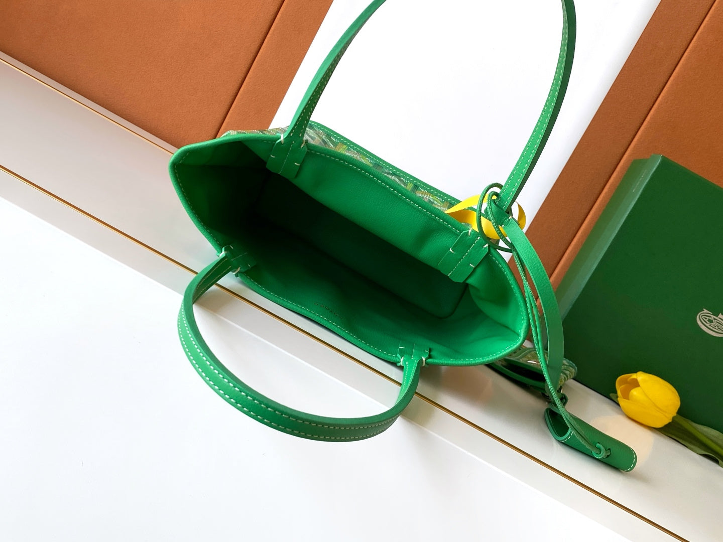 Green tote bag interior view with strap and lined inside pocket