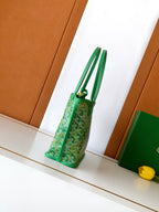 Green patterned tote bag with double top handles