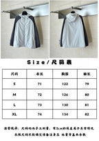 White hooded windbreaker jacket on hanger with drawstring neckline