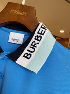 Blue Burberry polo shirt collar close-up with logo label and button placket