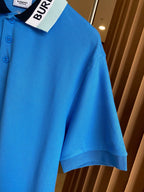 Blue Burberry polo shirt sleeve and collar detail with front button placket