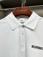 Close-up of white Burberry polo collar with three button front and logo patch