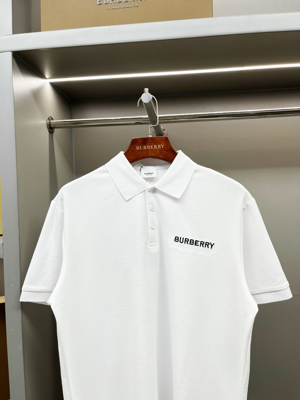 White Burberry polo shirt with fold-over collar and front button placket