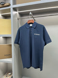 Blue polo shirt with collar and button placket, Burberry logo on chest