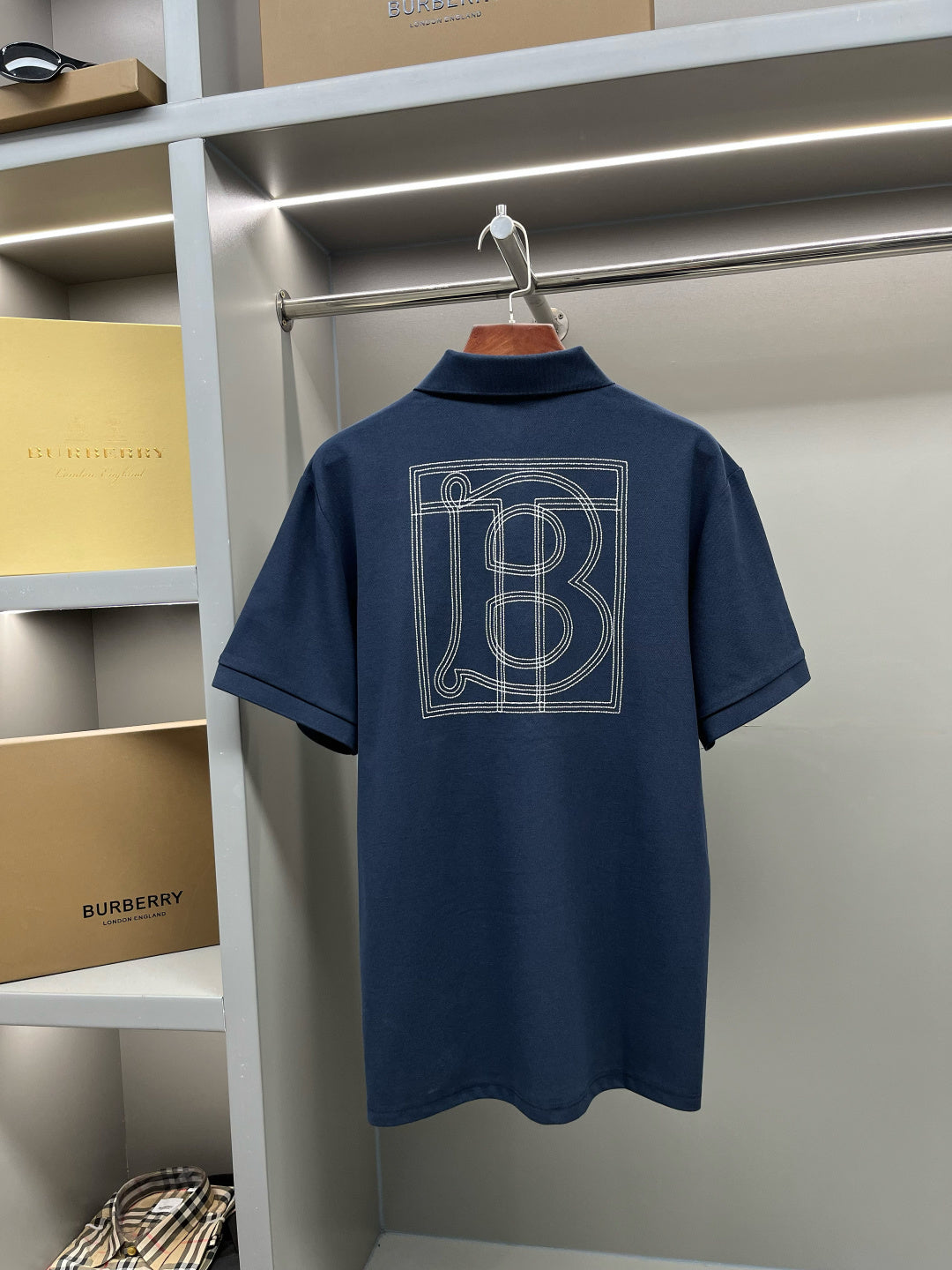 Blue polo shirt back with large Burberry monogram graphic