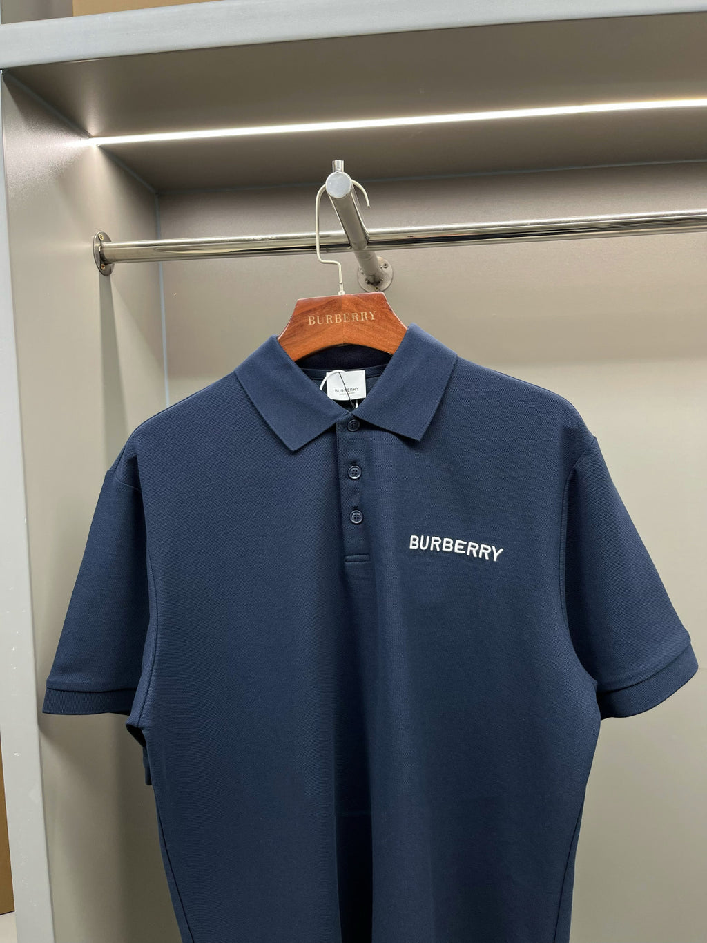 Blue polo shirt with collar and Burberry chest logo