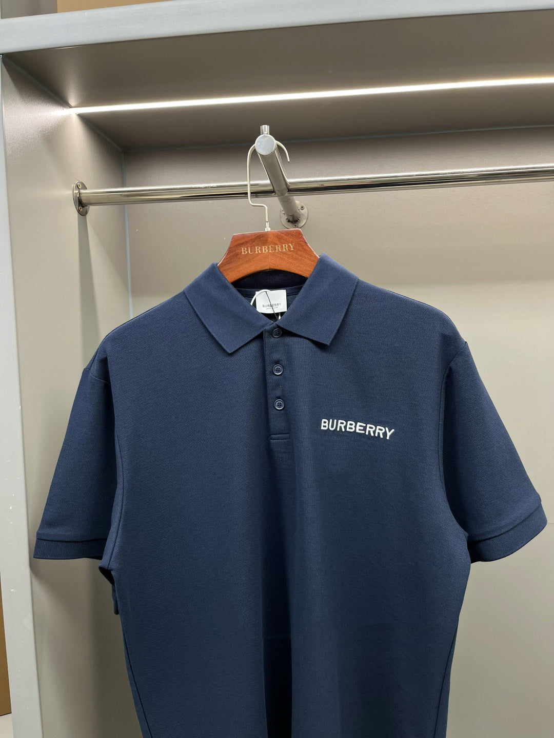 Blue polo shirt with collar and Burberry chest logo