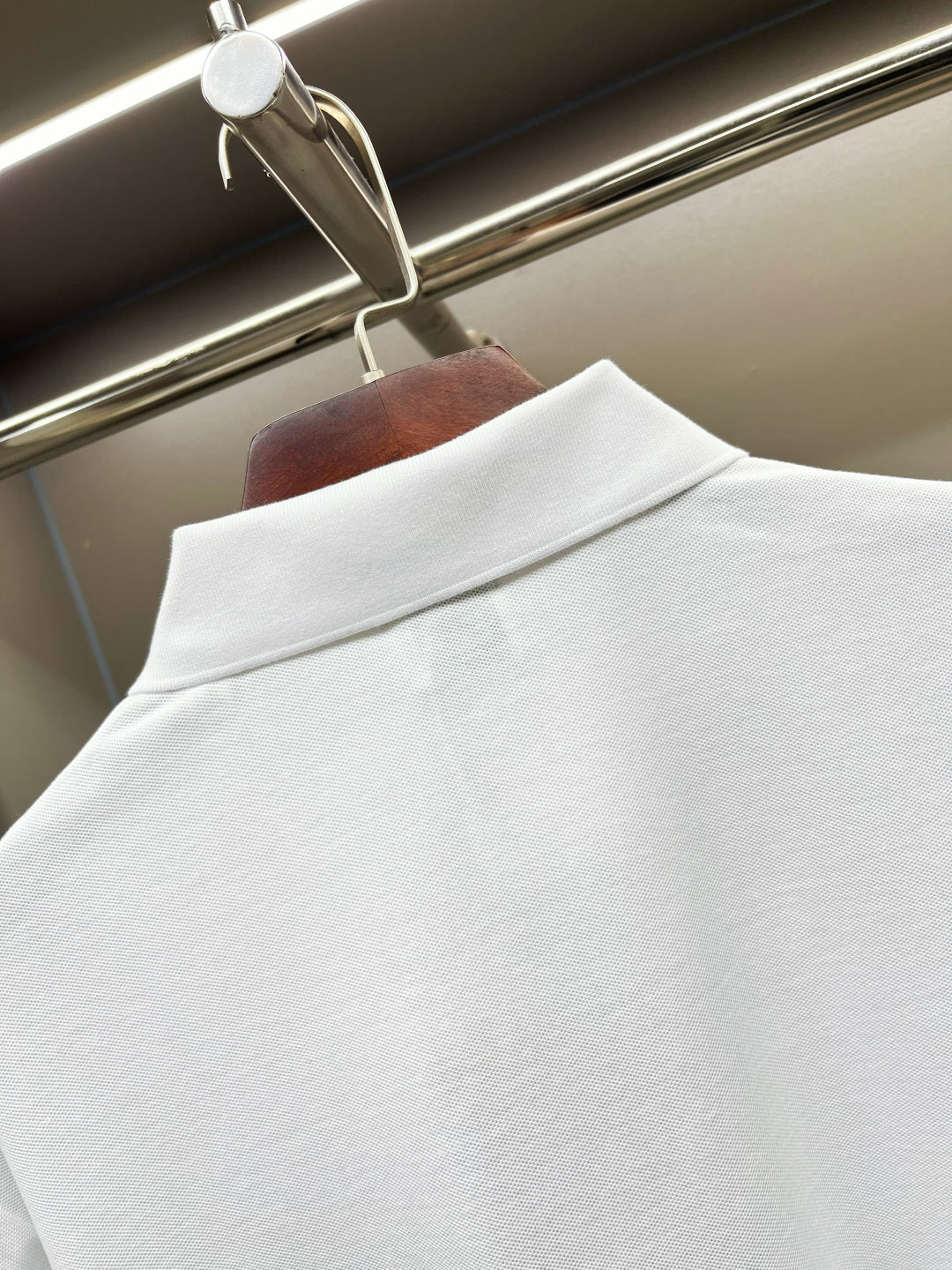 Burberry white polo shirt back collar area, smooth textured knit