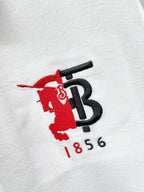 Burberry logo on white polo fabric in red and black with '1856'