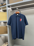 Dark blue polo shirt with button placket and red chest logo
