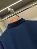 Dark blue polo shirt with ribbed collar and neckline