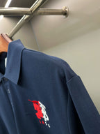 Dark blue polo shirt with red and white logo on back