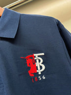 Dark blue polo shirt fabric with red and white chest logo