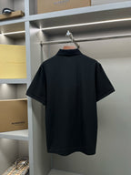 Black short-sleeve polo shirt back with plain knit and no visible logo.