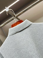Light gray polo shirt shoulder with folded collar