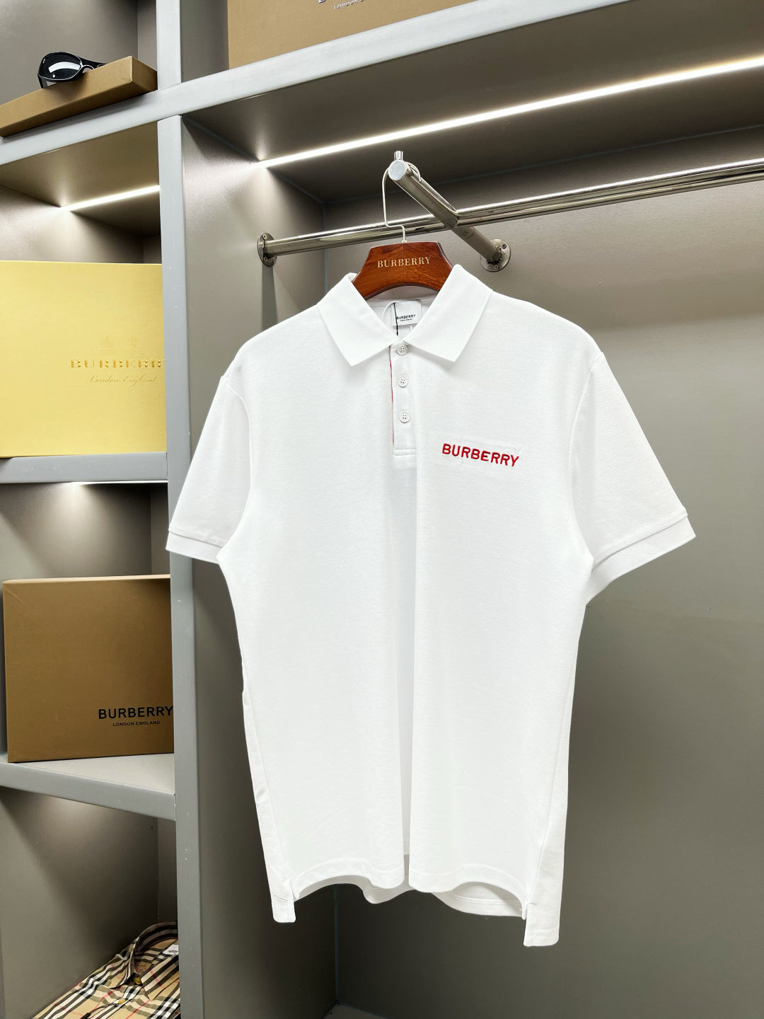 Burberry white polo shirt with red logo and button placket