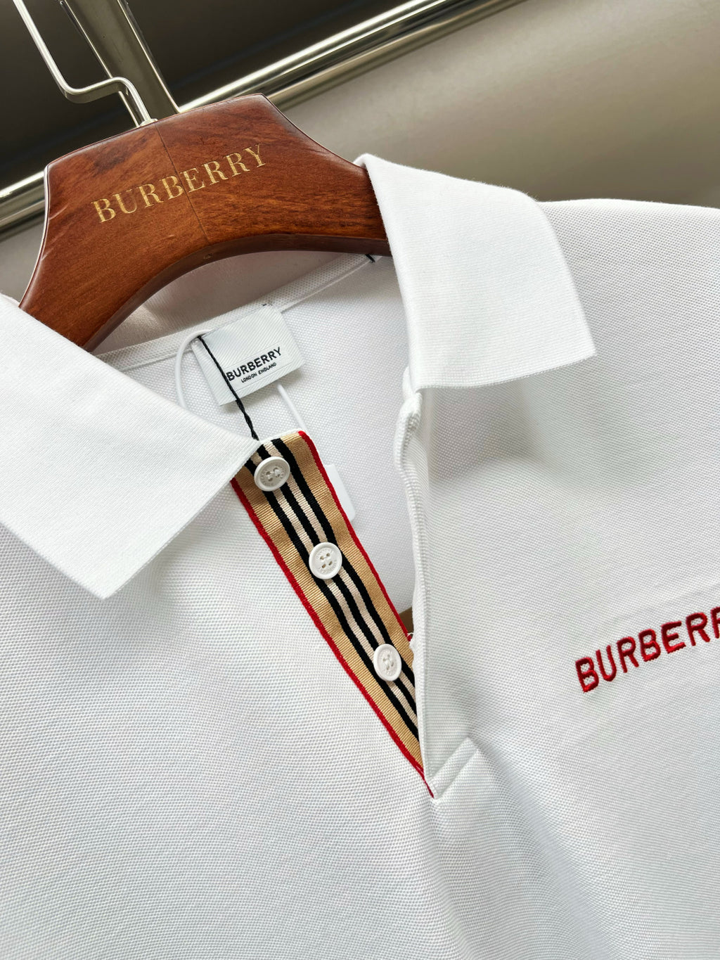 Burberry white polo shirt collar with red-and-yellow striped placket trim