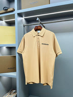 Beige polo shirt with Burberry logo on chest, buttoned collar, short sleeves