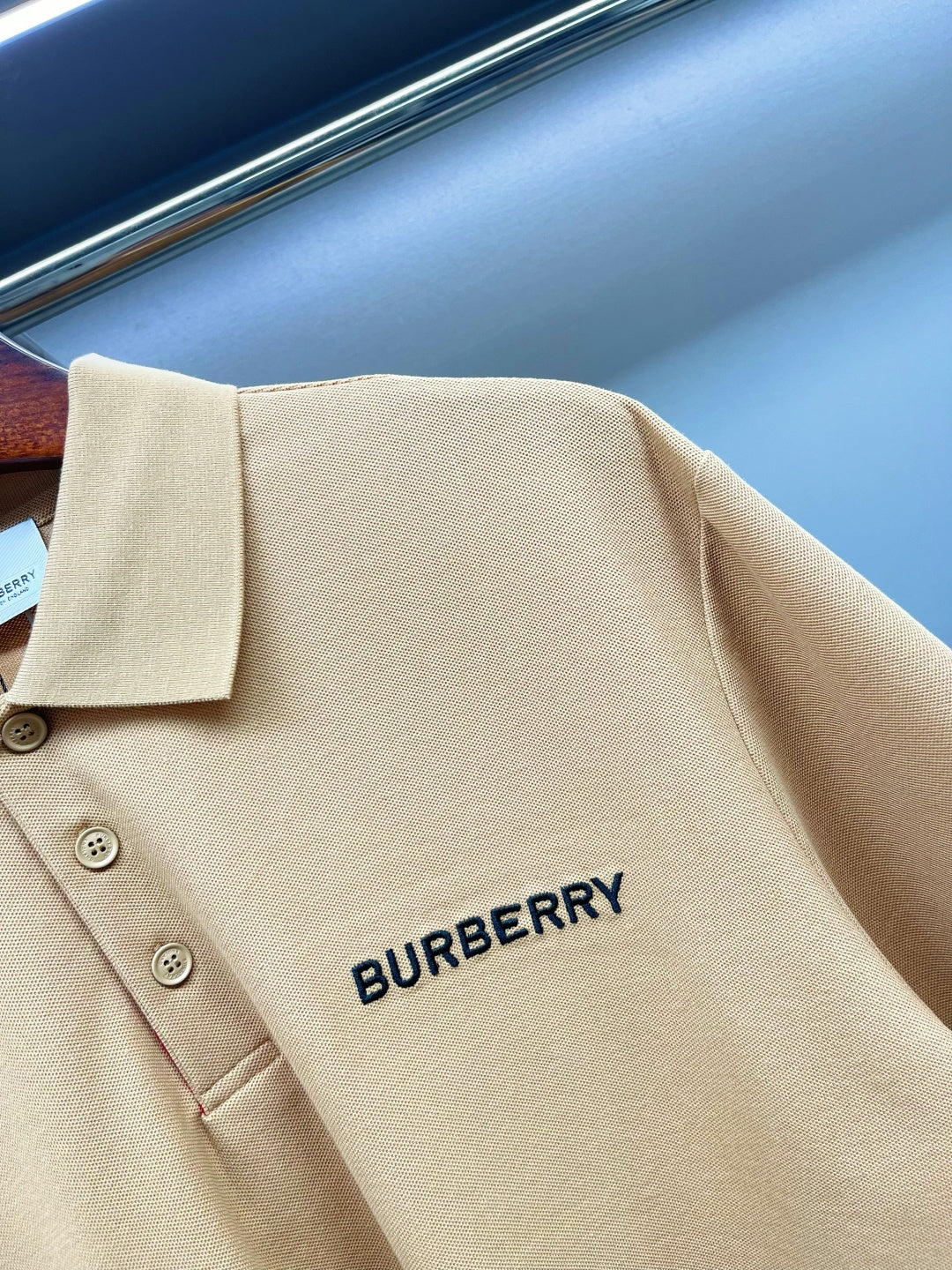 Beige polo shirt back close-up with Burberry logo print