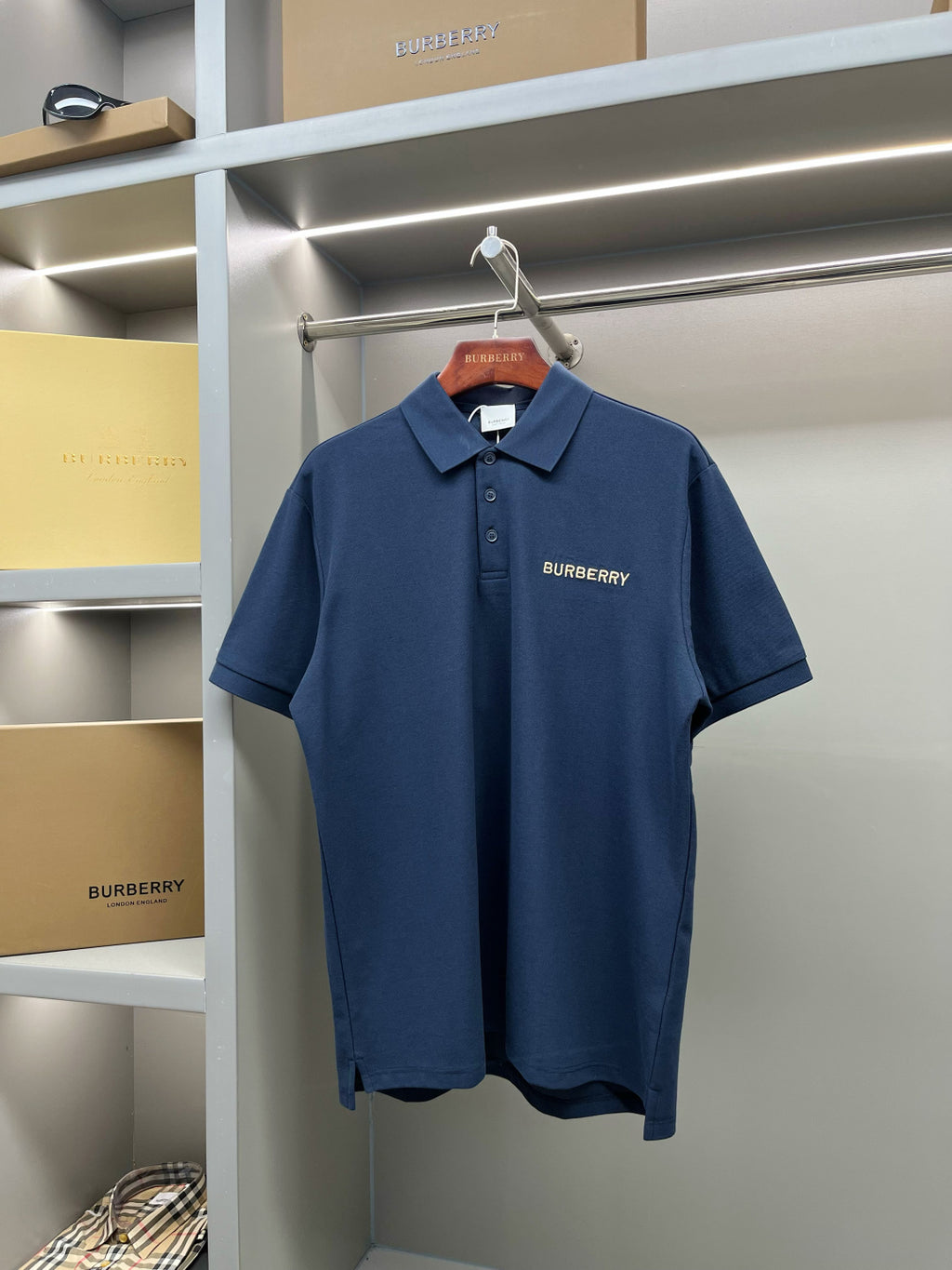 Blue Burberry polo shirt with button placket and chest logo