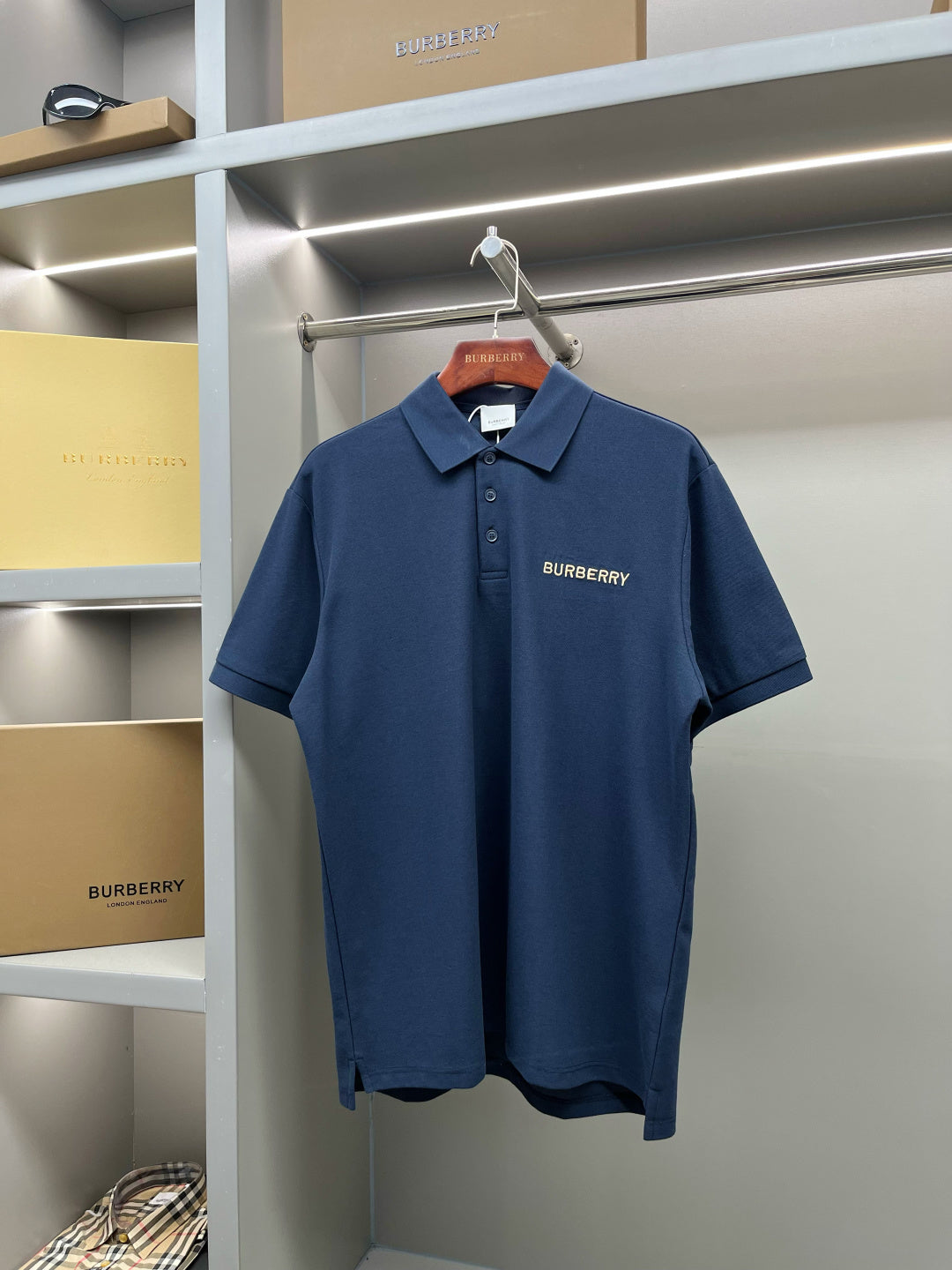 Blue Burberry polo shirt with button placket and chest logo