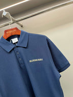 Blue Burberry polo shirt with short sleeves and embroidered chest logo