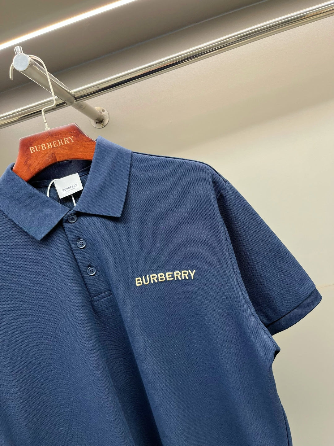 Blue Burberry polo shirt with short sleeves and embroidered chest logo