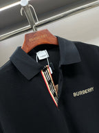 Burberry polo shirt with contrast striped placket and navy logo on chest