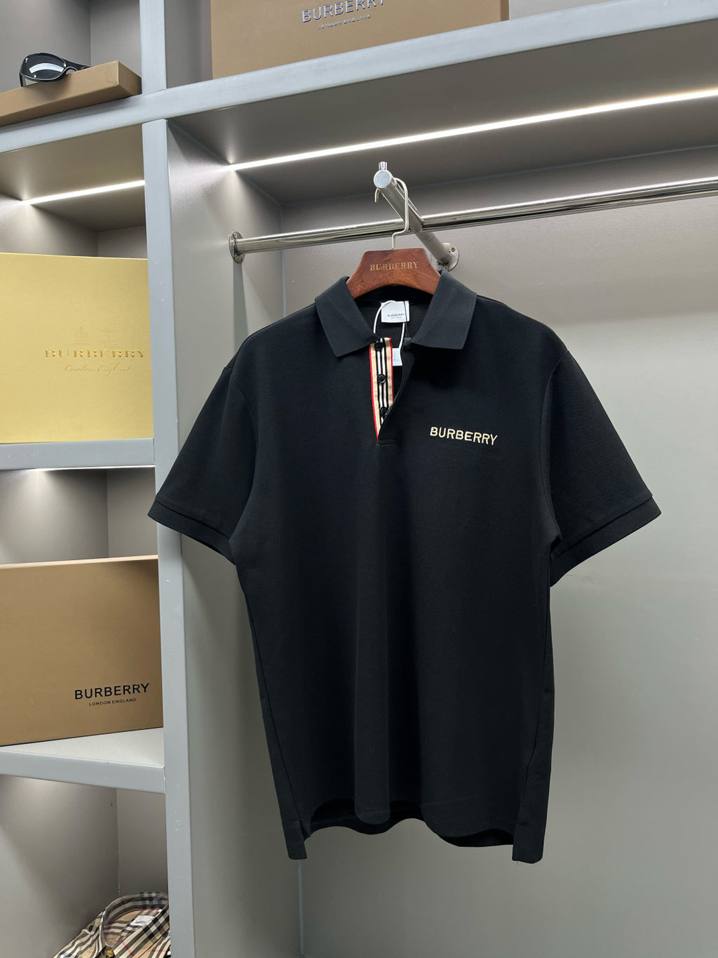 Burberry short-sleeve polo shirt, dark navy, open collar and chest logo
