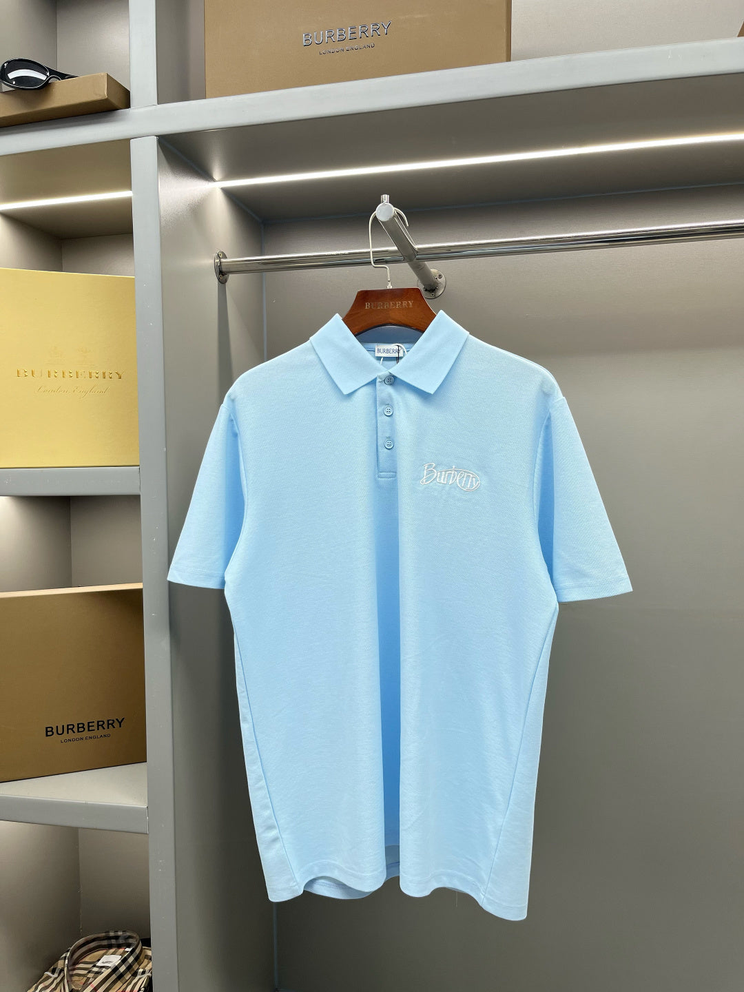 Burberry light blue short-sleeve polo shirt with button placket and chest logo